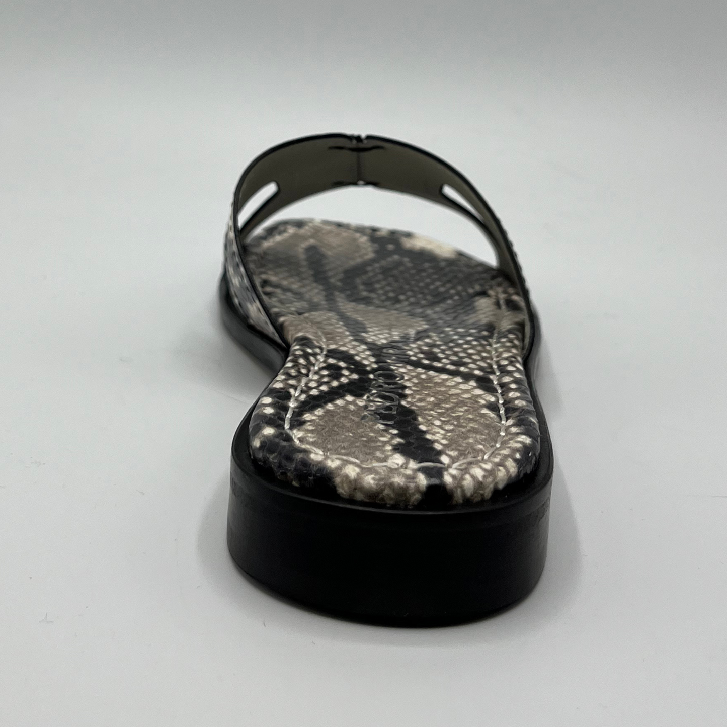 Back view of a snake print leather flat sandal with a leather lining and upper.