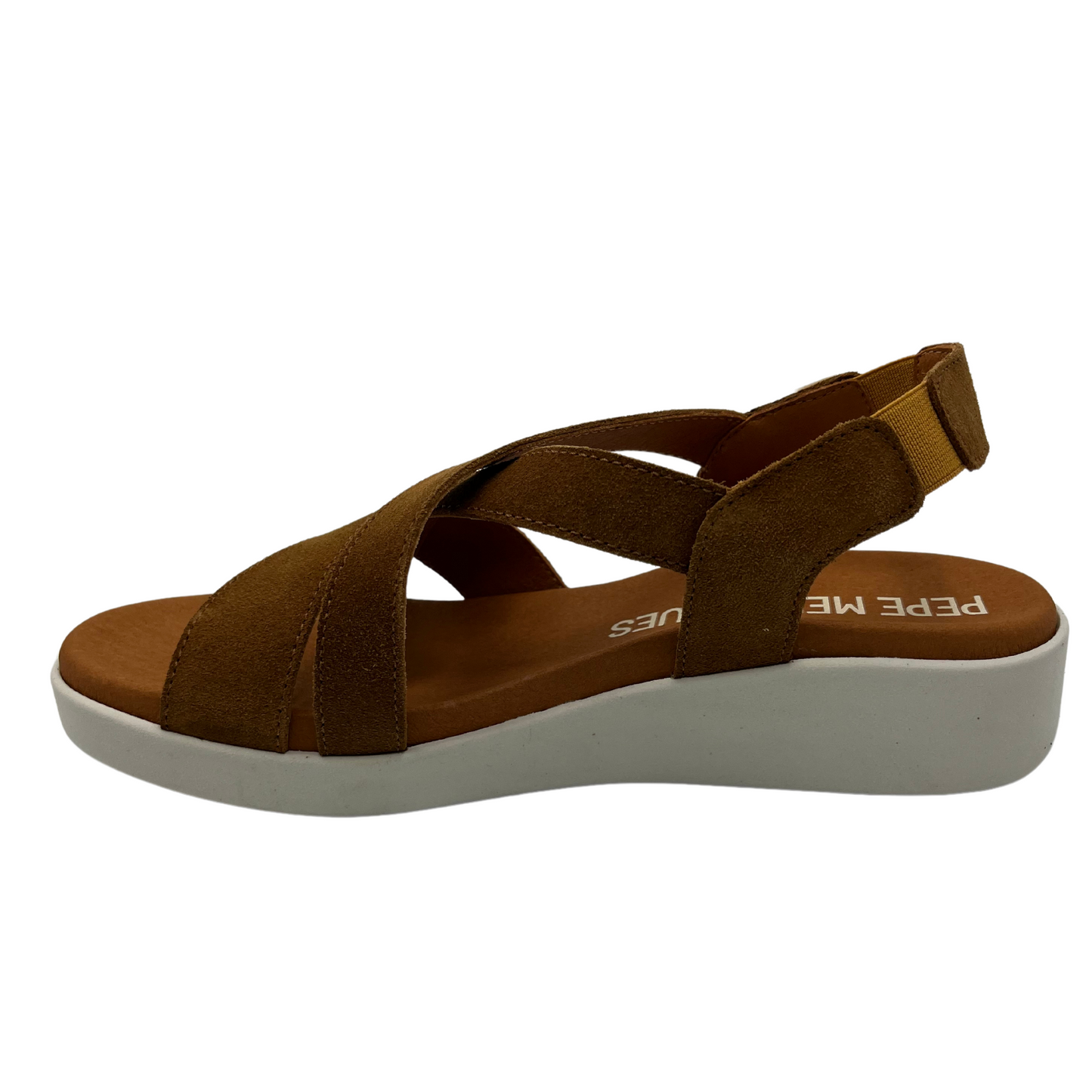 Left facing view of brown suede sandal with elastic sling back strap and white rubber outsole