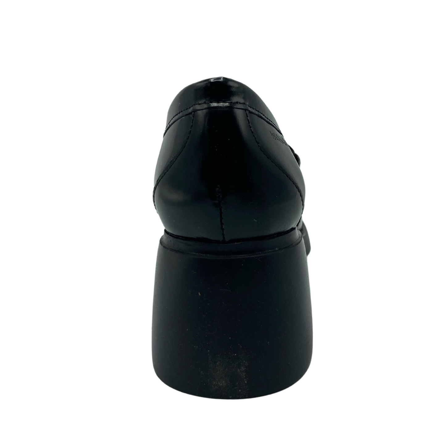 Heel view of black chunky heel and glossy black upper