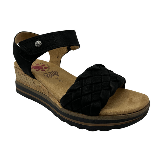 45 degree angled view of black strapped wedge sandal with velcro strap