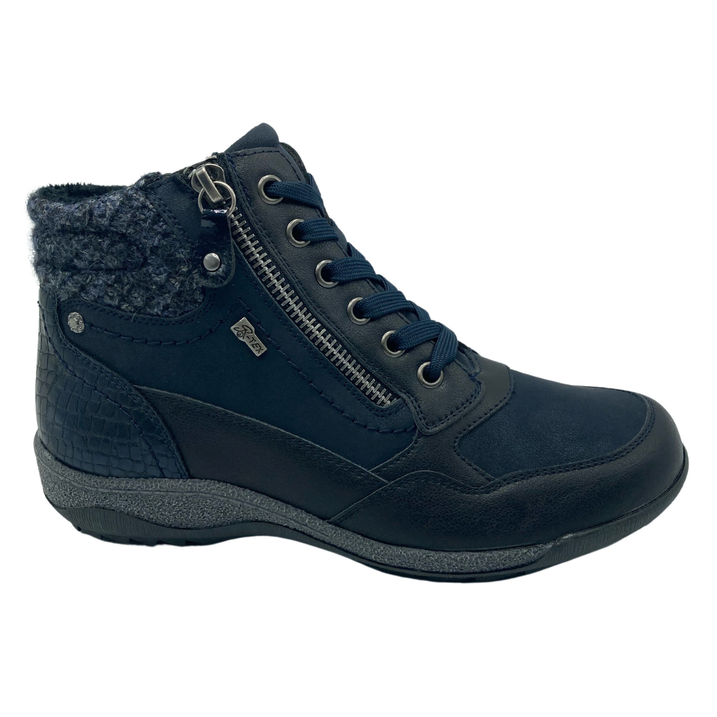 Right facing view of blue vegan suede and leather ankle boot with rubber outsole