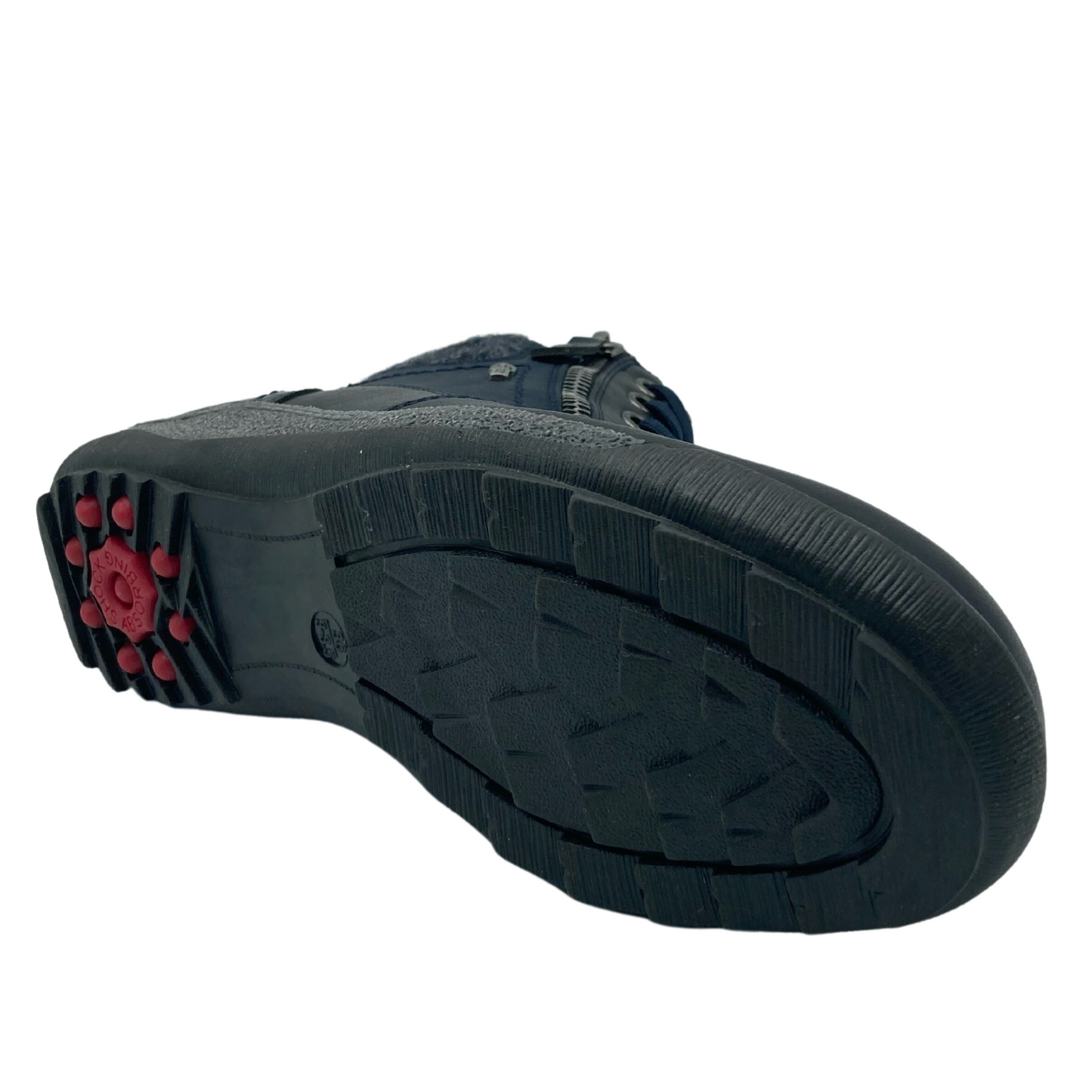 View of the bottom of a navy ankle boot with rubber outsole