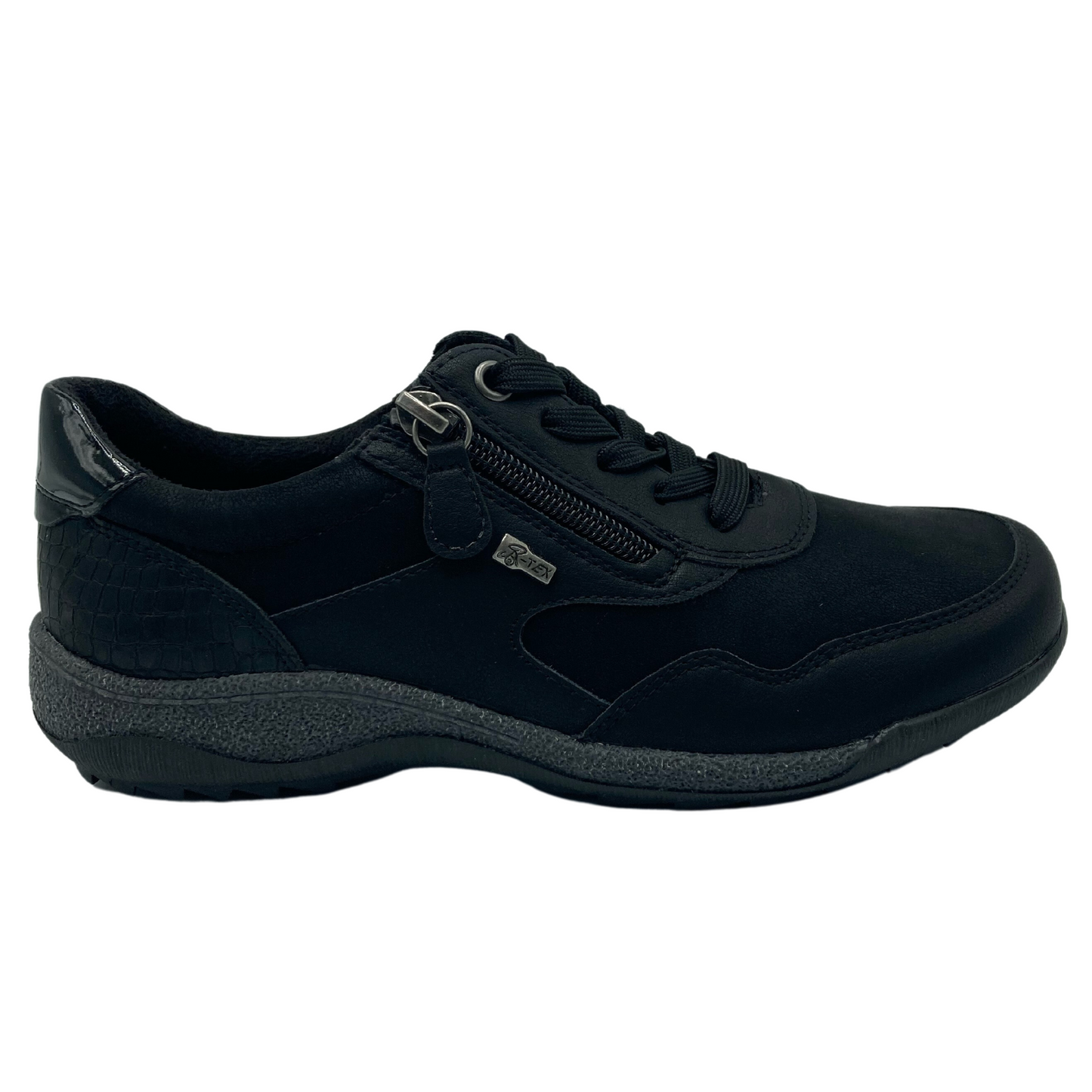 Right facing view of black vegan leather sneaker with side zipper closure and grey and black rubber outsole
