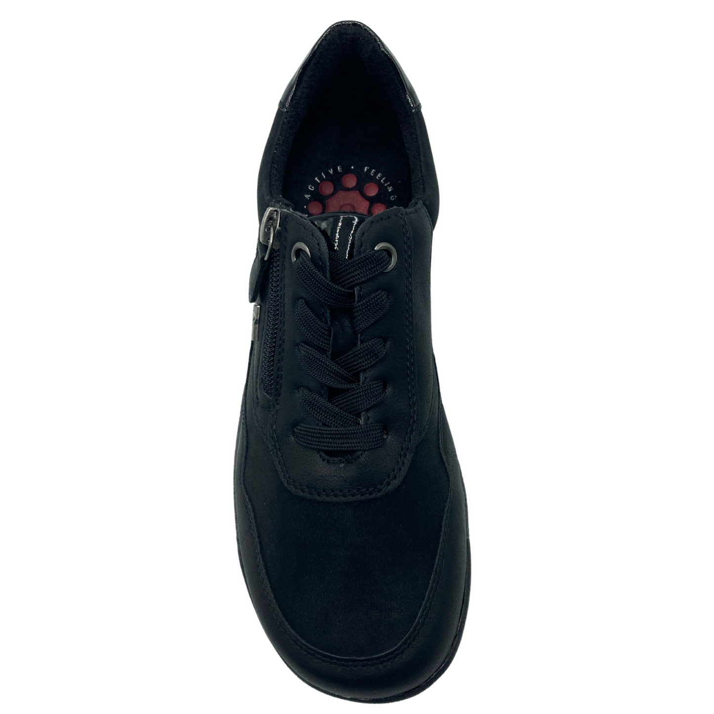 Top view of black sneaker with black laces, lining and side zipper closure