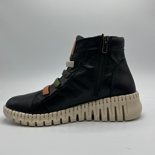 Black high-top sneaker with a thick white sole on a light gray background