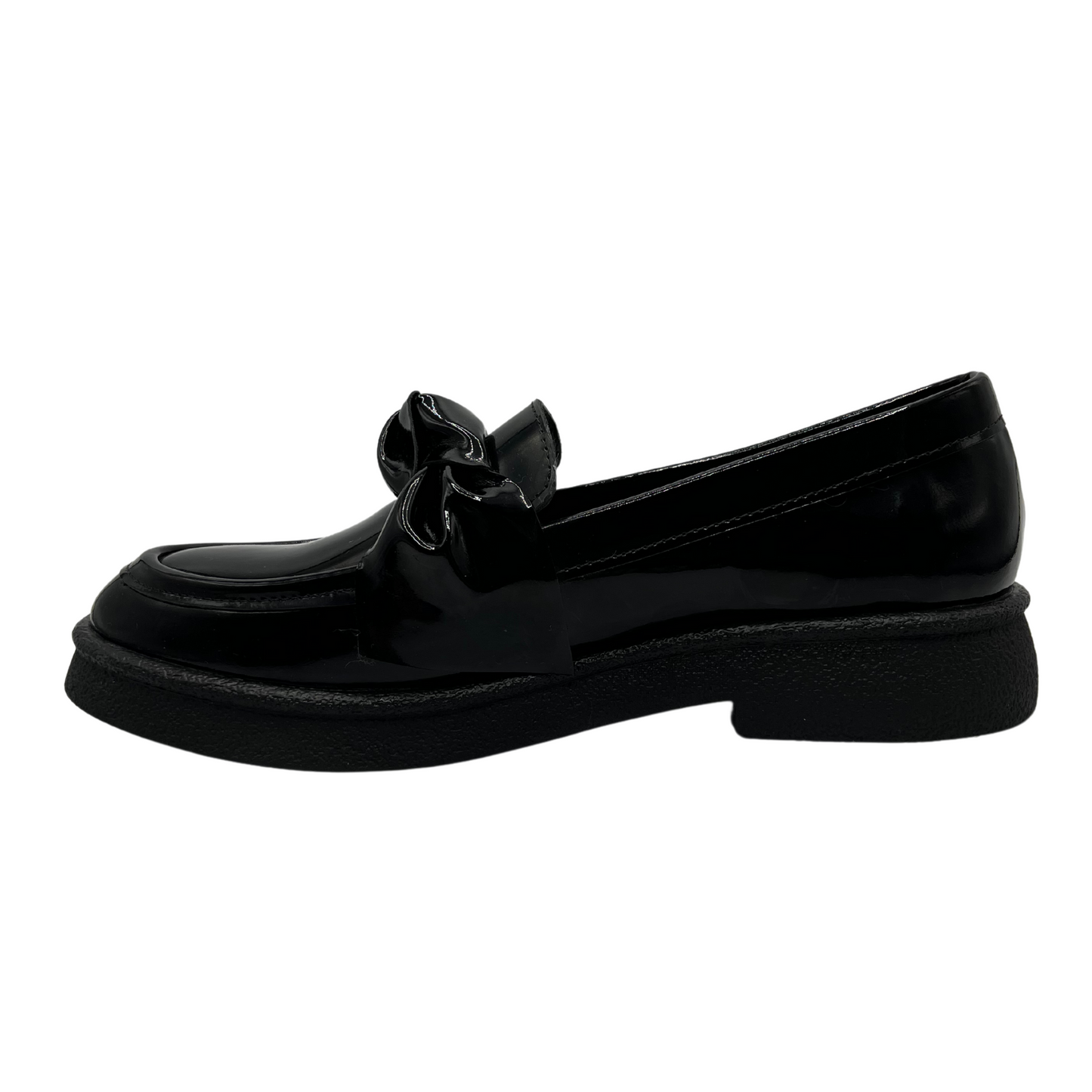 Left facing view of black patent leather loafer with knotted strap detail and black rubber outsole