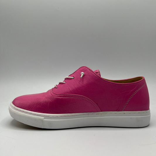 Left facing view of a fuschia leather sneaker with elastic laces and a white rubber outsole.
