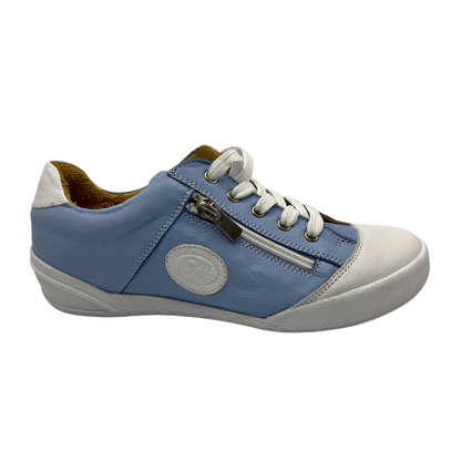 Right facing view of blue and white leather sneaker. It has tan leather lining and side zipper along laces. White rubber outsole and white leather toe cap.