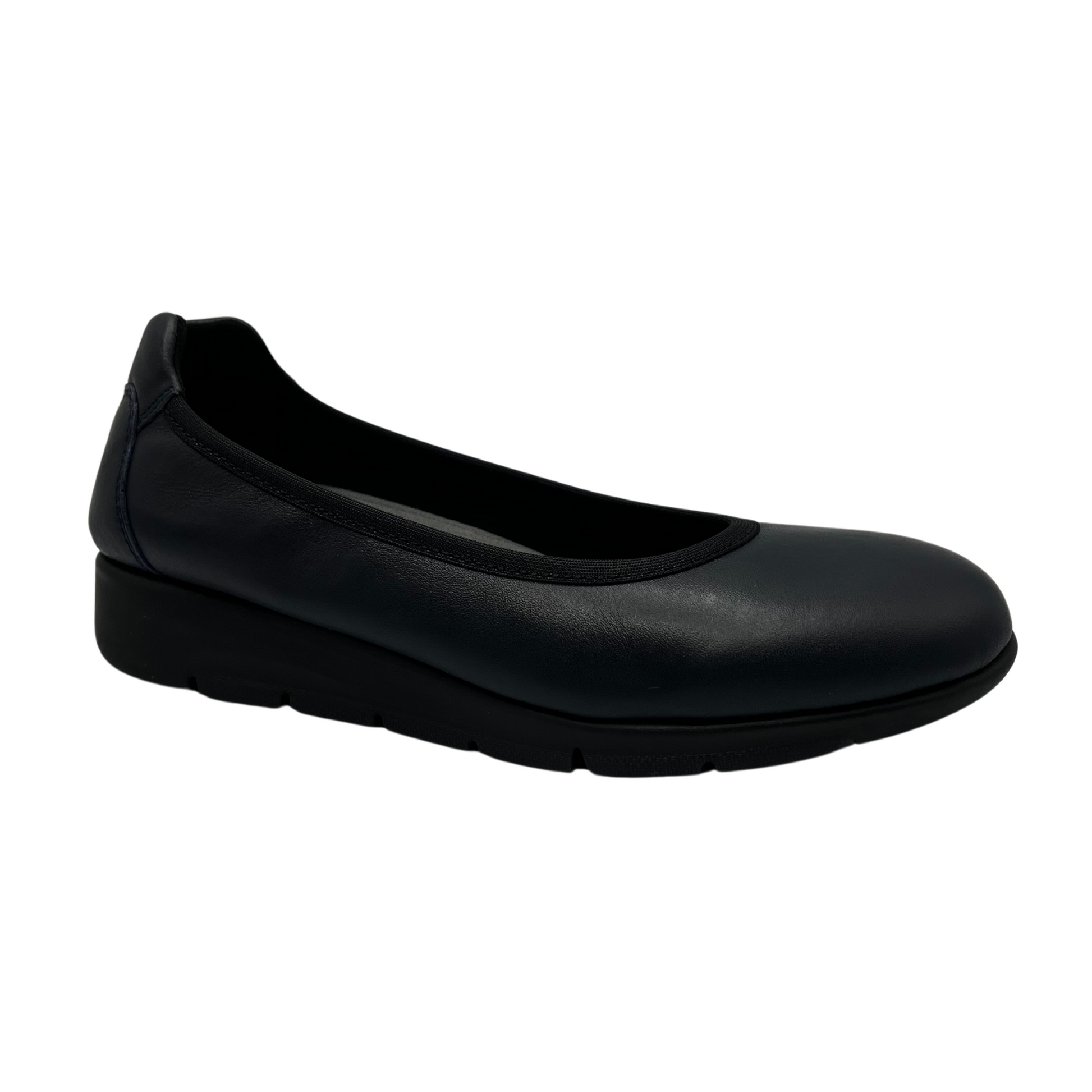 45 degree angled Top view of navy low wedge shoe with rounded toe and textile lining