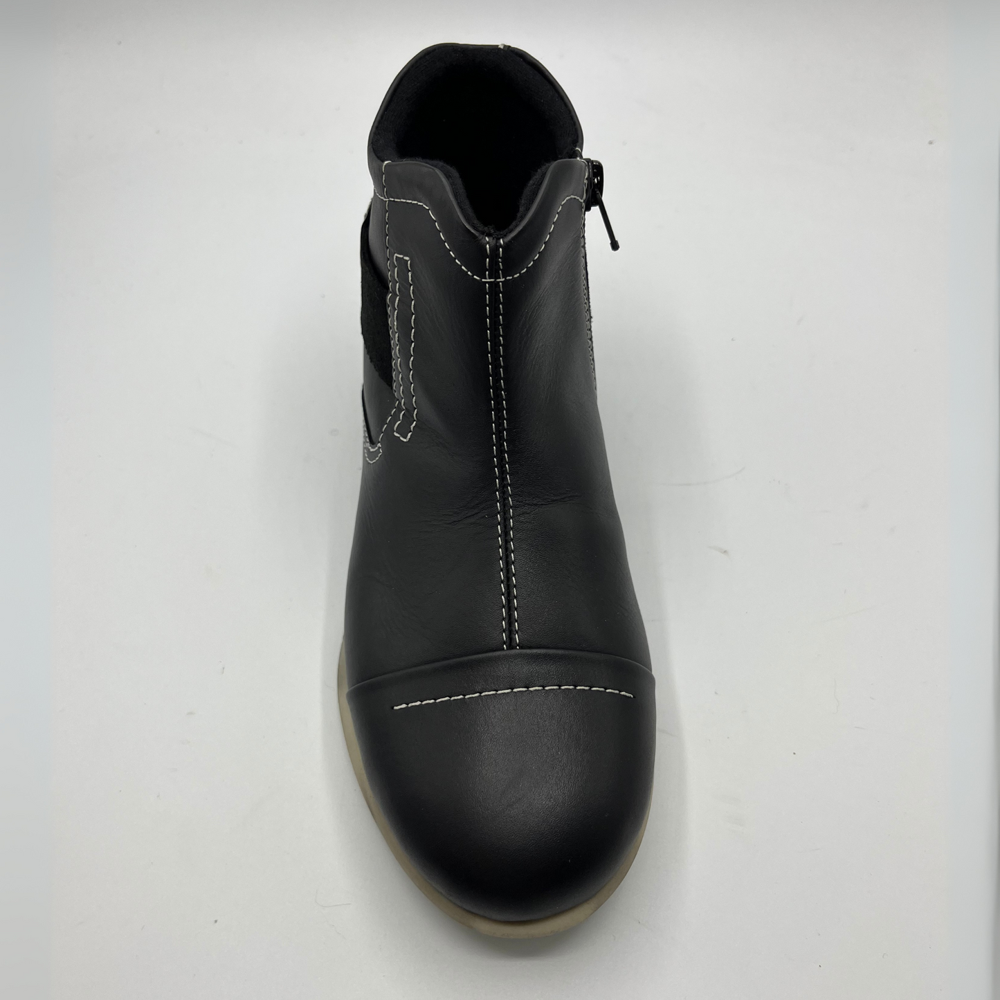 Black leather boot on a white background