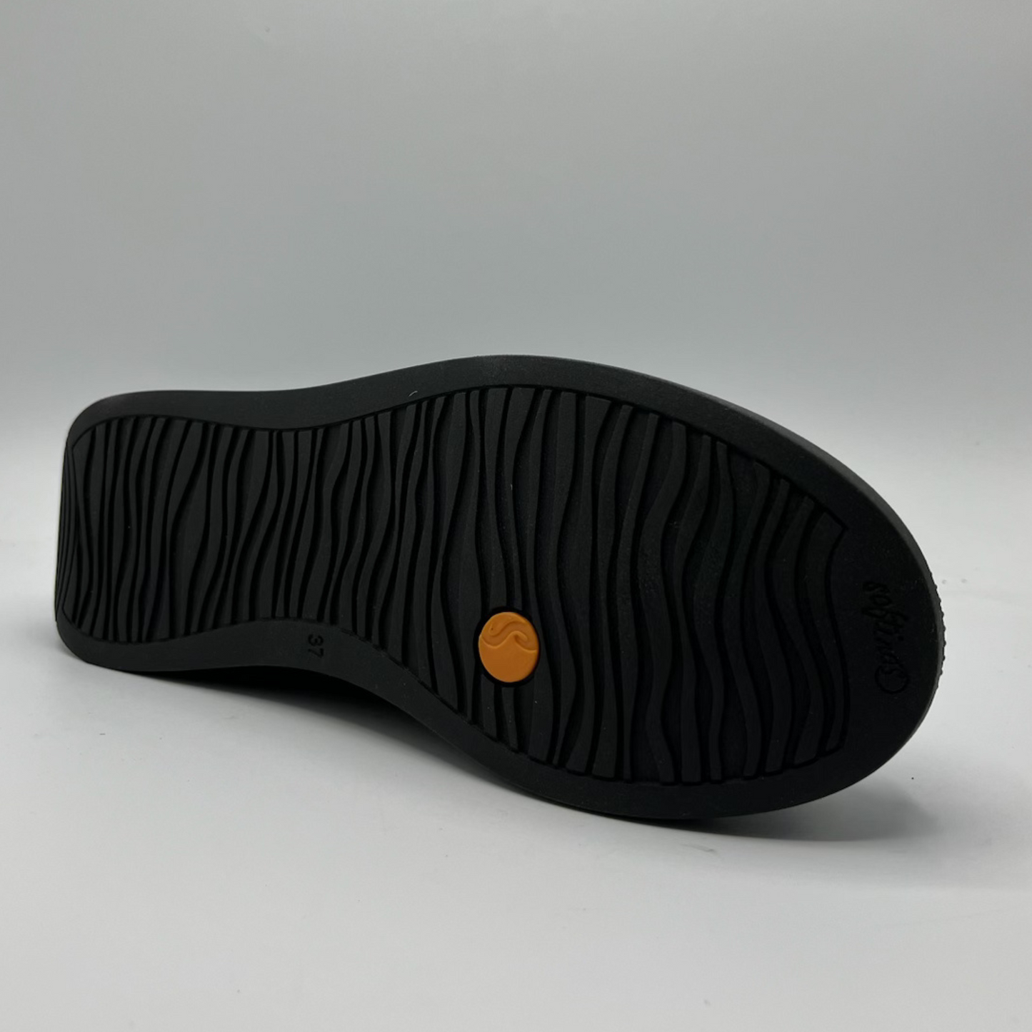 Black shoe sole with a brown circular logo on a gray background