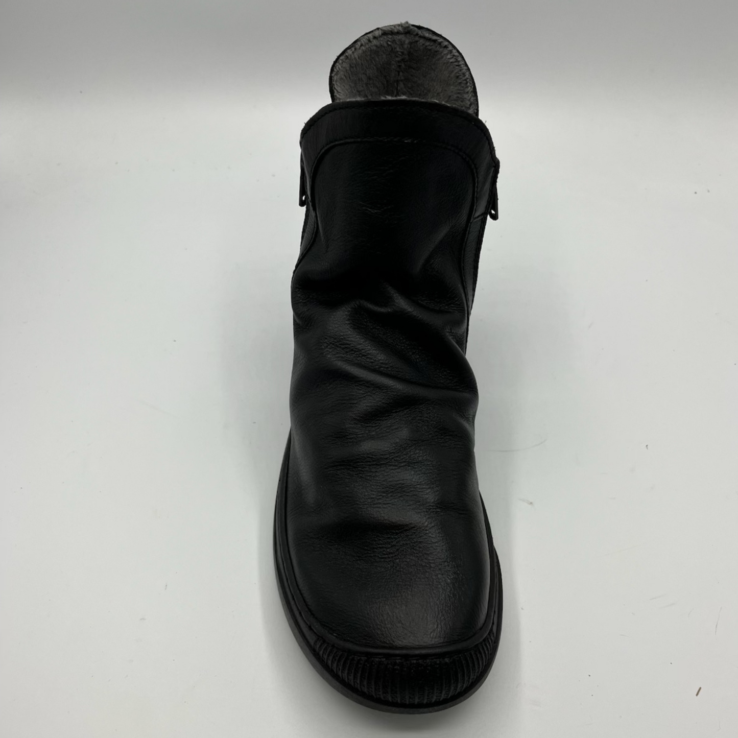 Black leather boot on a white background
