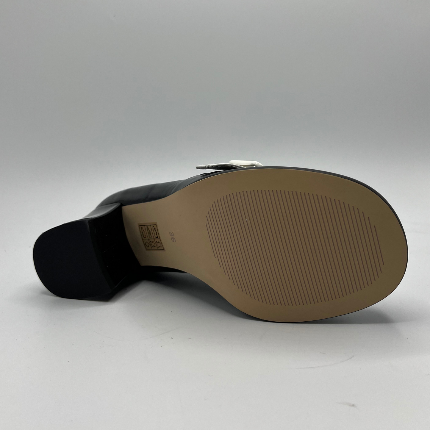 Black shoe sole with brand logo on a white background