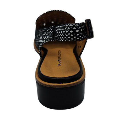 Back view of perforated leather shoe with slingback strap, low heel and rounded toe