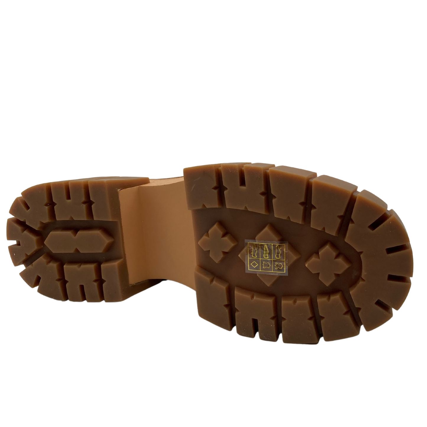 Bottom view of brown rubber outsole of navy leather boot
