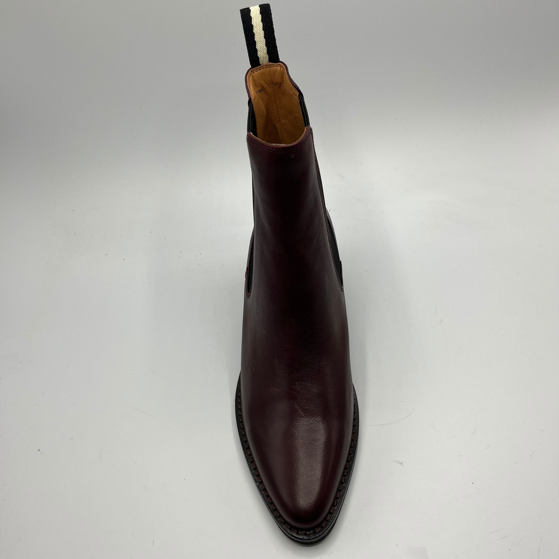 Brown leather boot on a white background