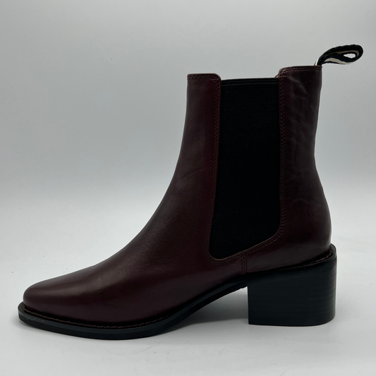 Brown ankle boot on a light gray background