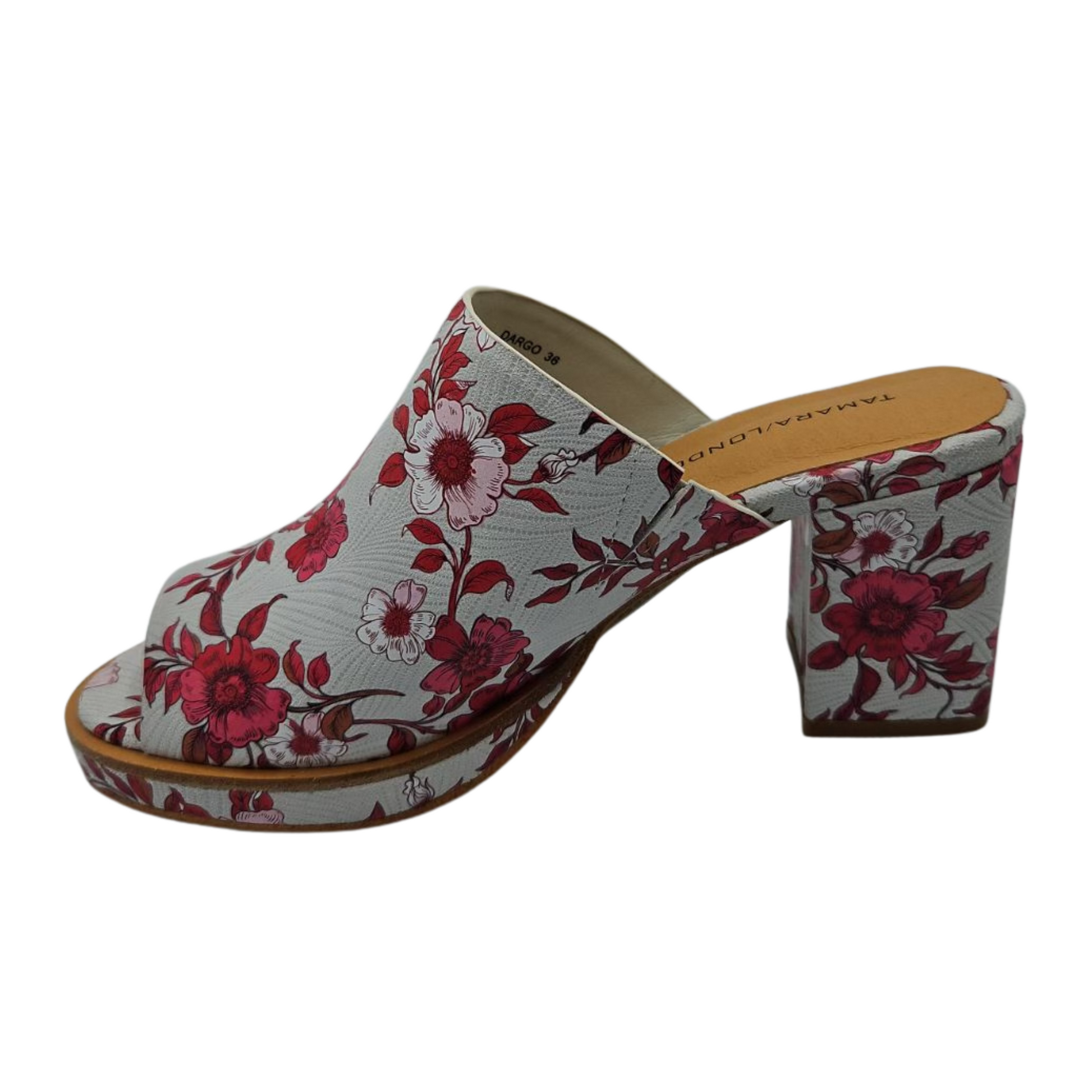 Left view of bold floral slip on sandal with wrapped block heel and cushioned footbed.