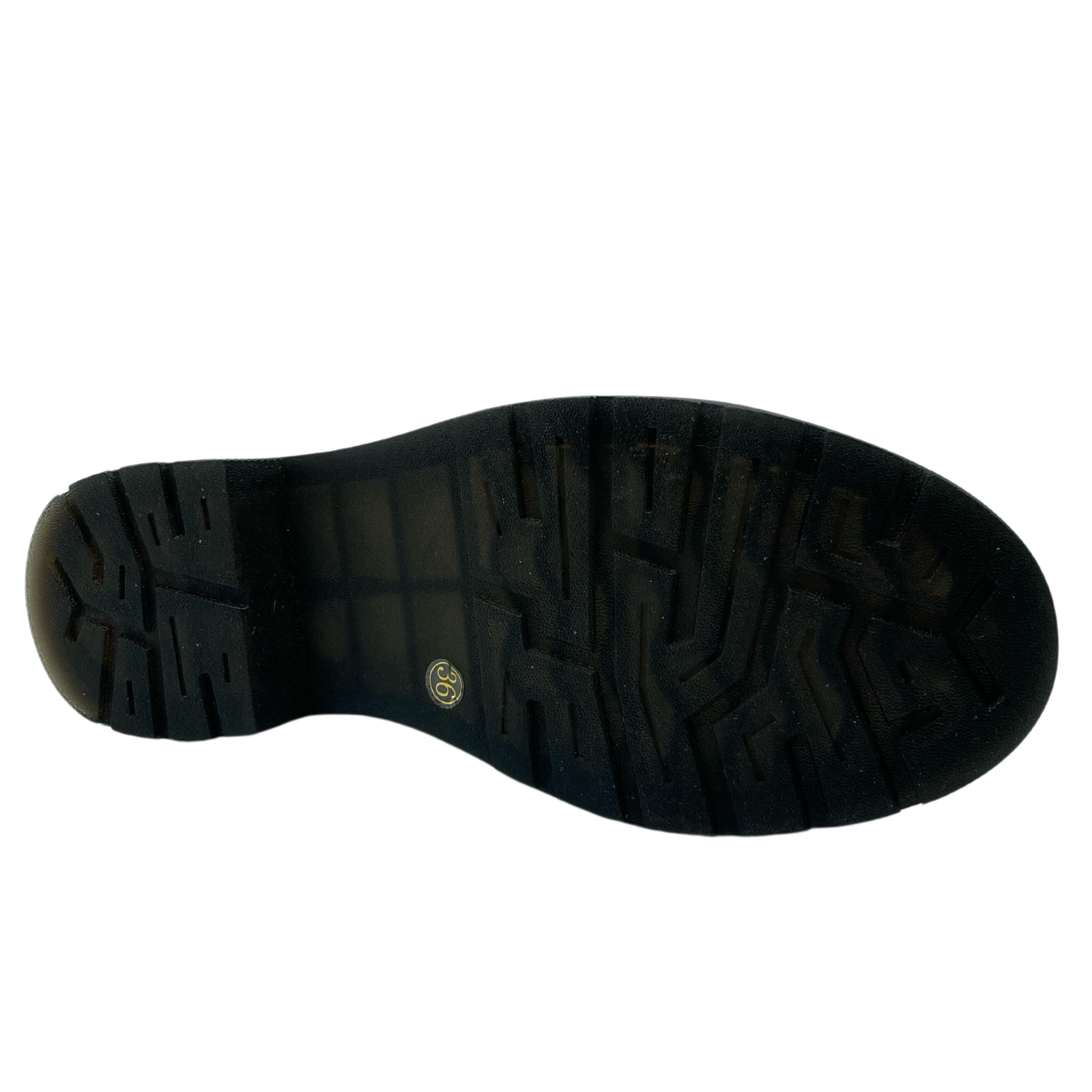 Bottom view of leather short boot with black rubber outsole