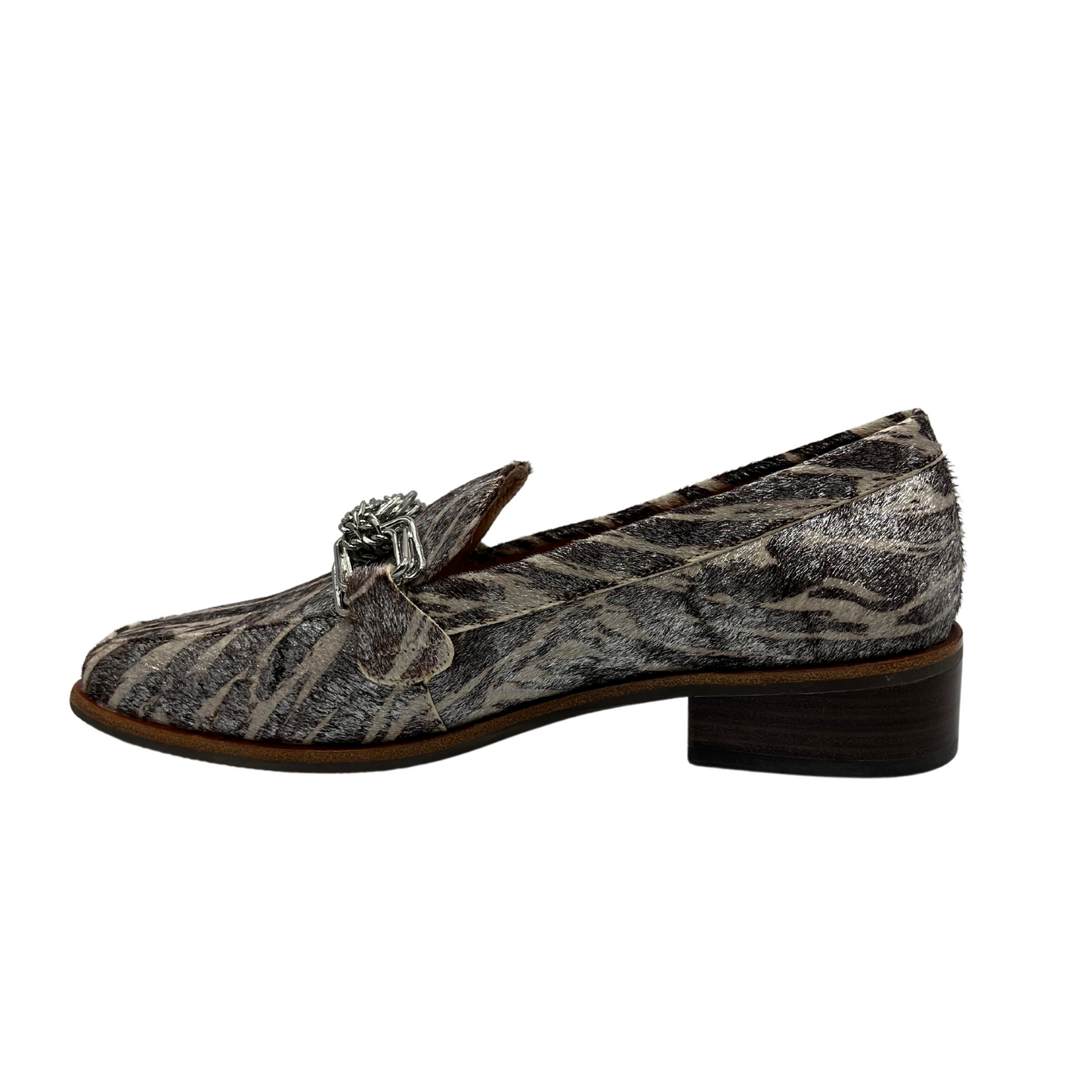 Left facing view of leather loafer with short stacked heel, leather lining and chain detail on upper.