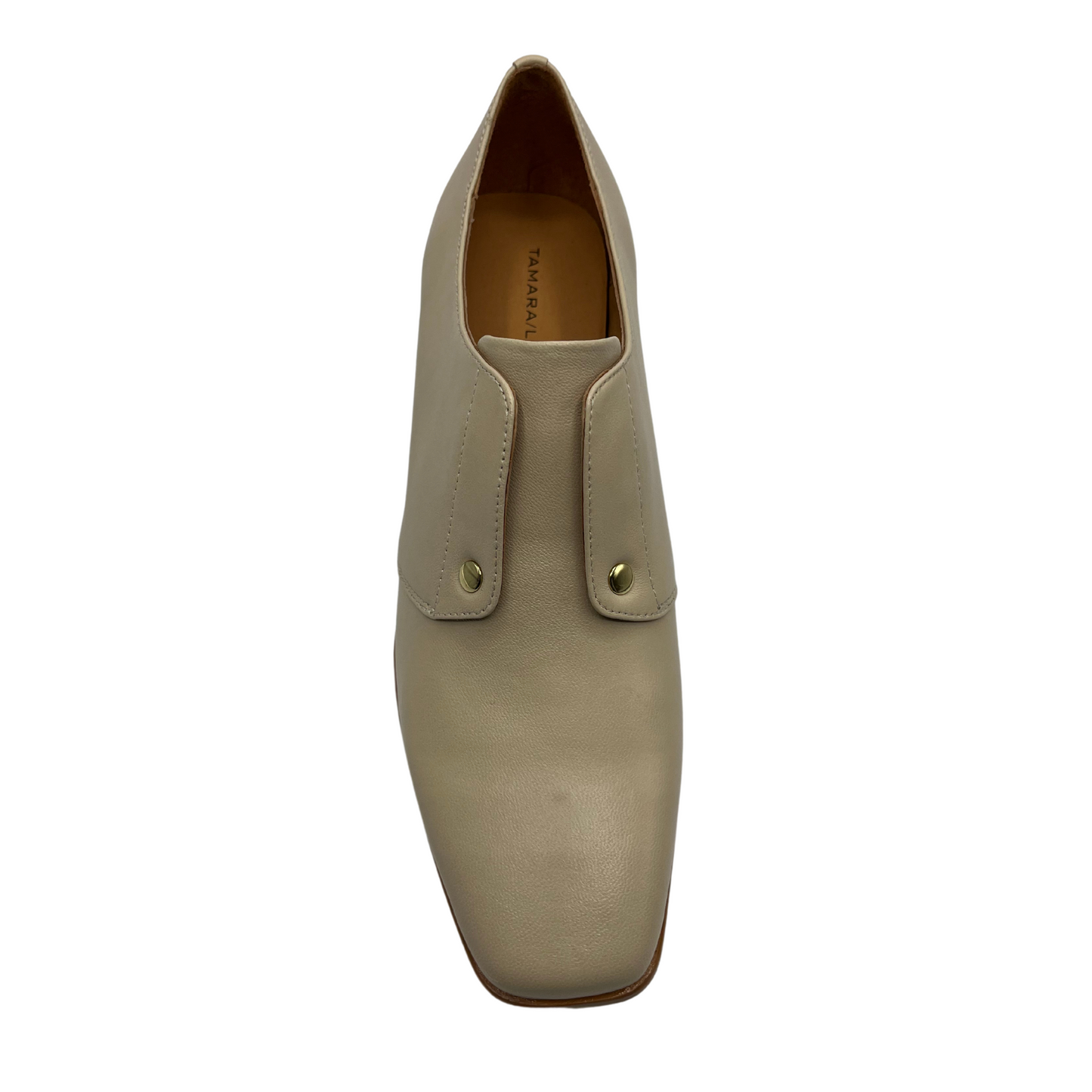 Top view of nude leather loafer with wood block heel and gold detail.