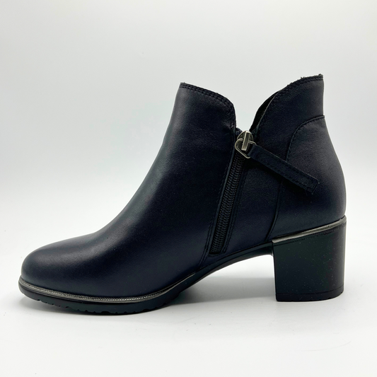 Black ankle boot with a block heel on a white background