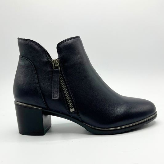 Black leather ankle boot with a zipper on a white background