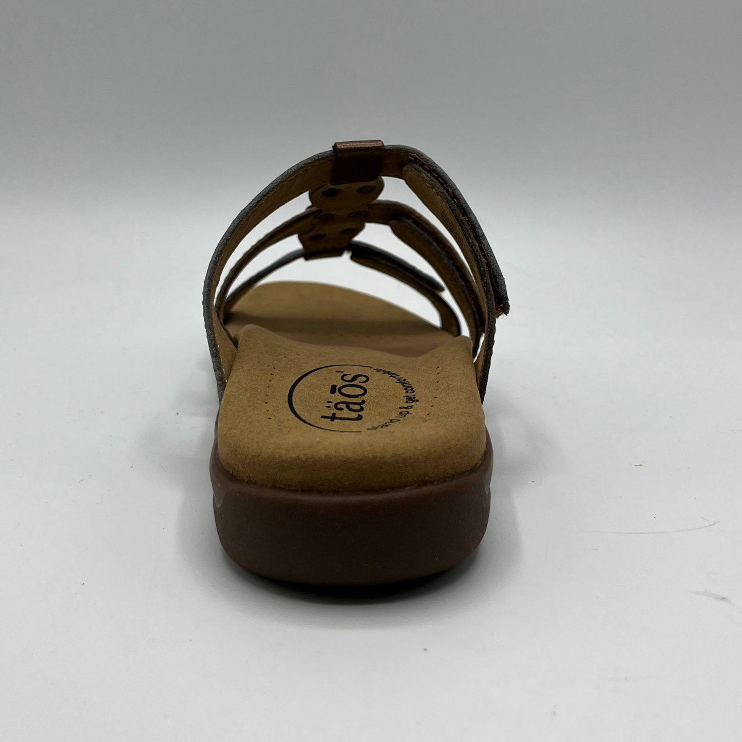 Back view of leather sandal with 3 straps and slip on style. Hook and loop closures on straps and lined anatomical footbed