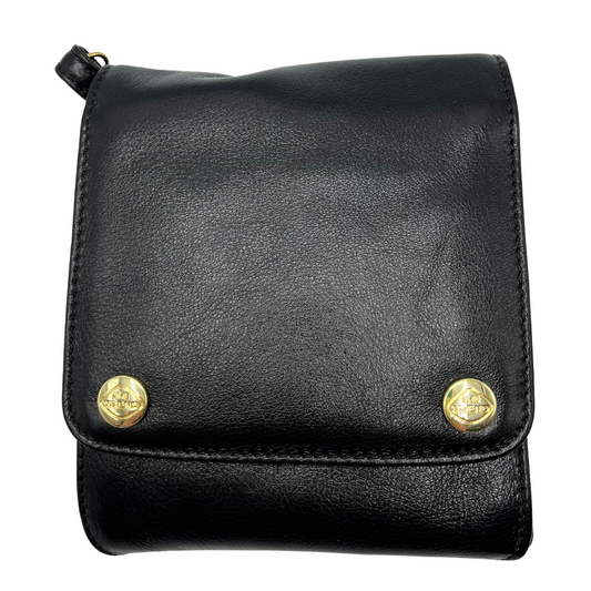 A front view of a square black leather handbag with two gold snaps on the front.