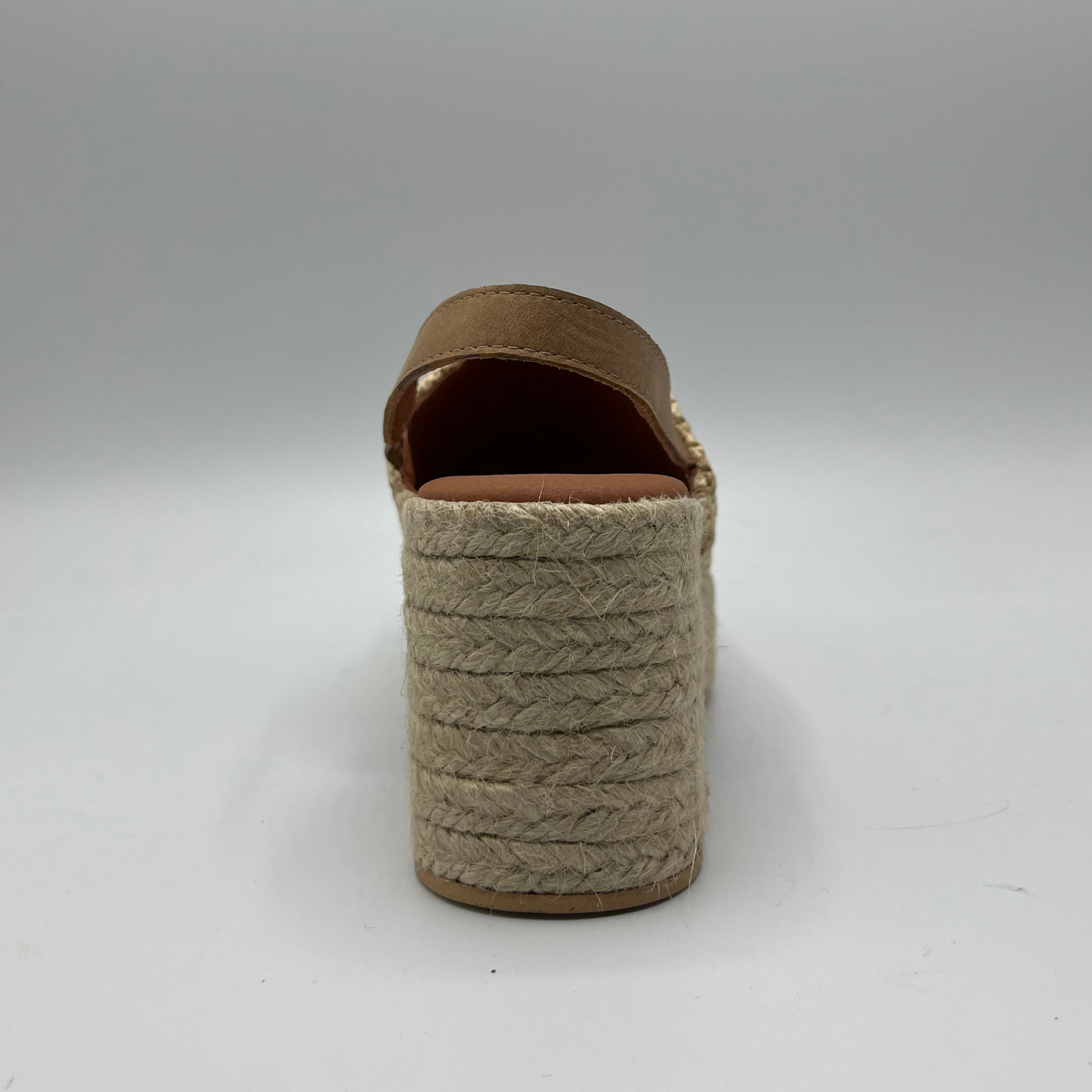 Back view of a chunky wedge heel with an elasticated slingback strap and peep toe.