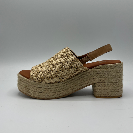 Left facing view of a chunky wedge heel with an elasticated slingback strap and peep toe.