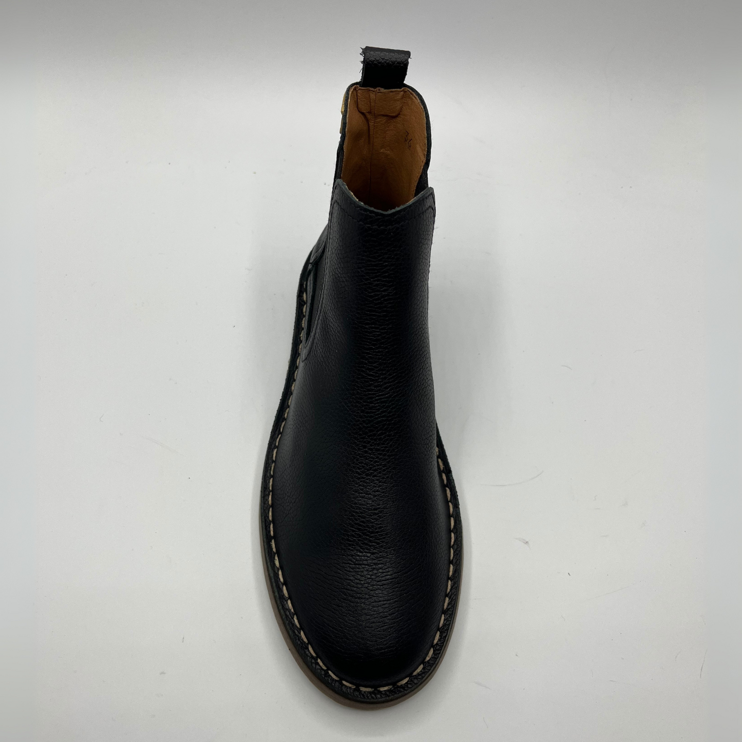 Black leather boot on a white background