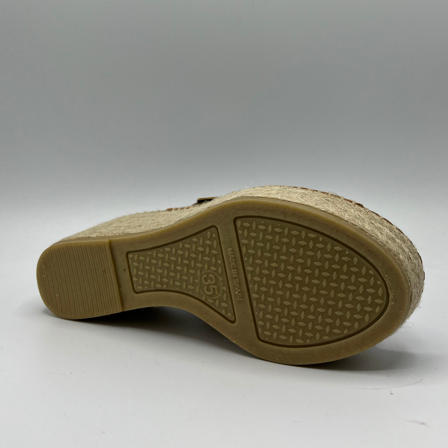 Bottom view of a khaki leather espadrille sandal with wedge heel and stitching round sole