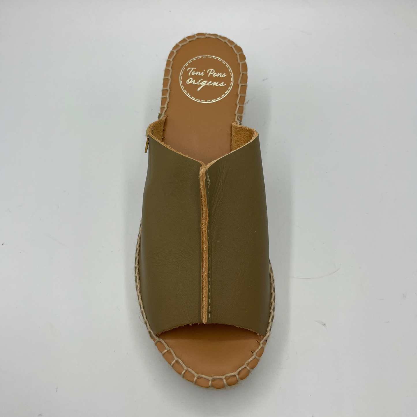 Top view of a khaki leather espadrille sandal with wedge heel and stitching round sole