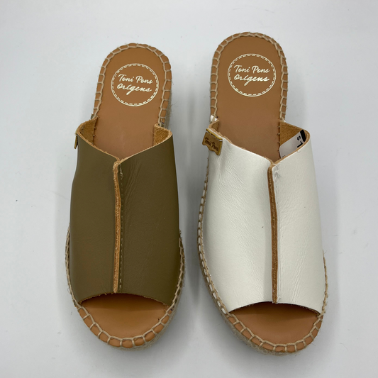 Top view of two leather espadrille sandals with a wedge heel and stitching round sole