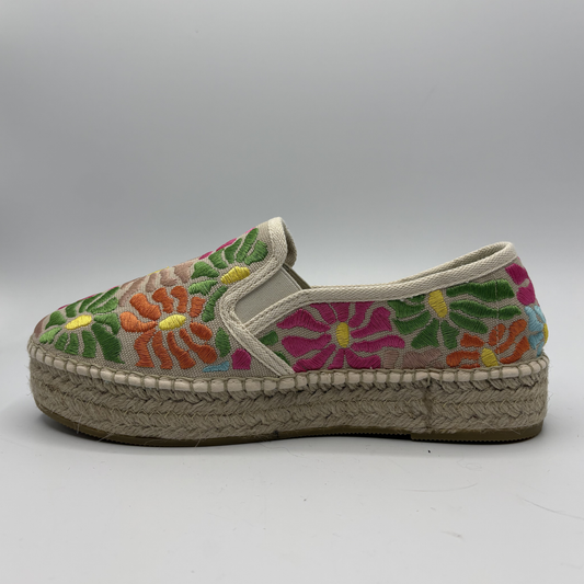 Colorful floral espadrille shoe on a gray background