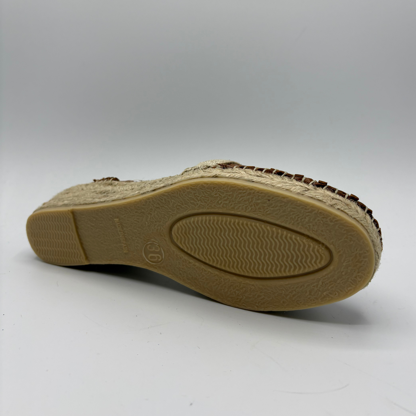 Beige sandal sole on a white background