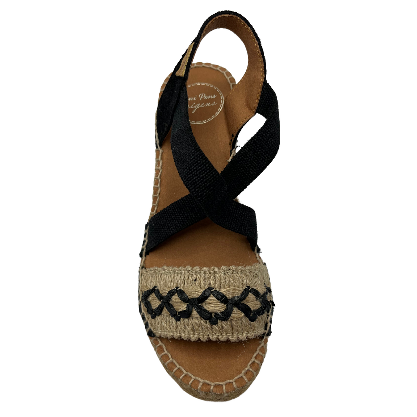 Top view of black and beige wedge sandal with X pattern across toe
