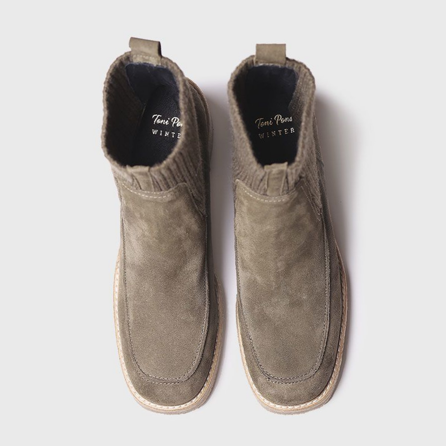 Top view of a pair of army green boots with soft squared toe
