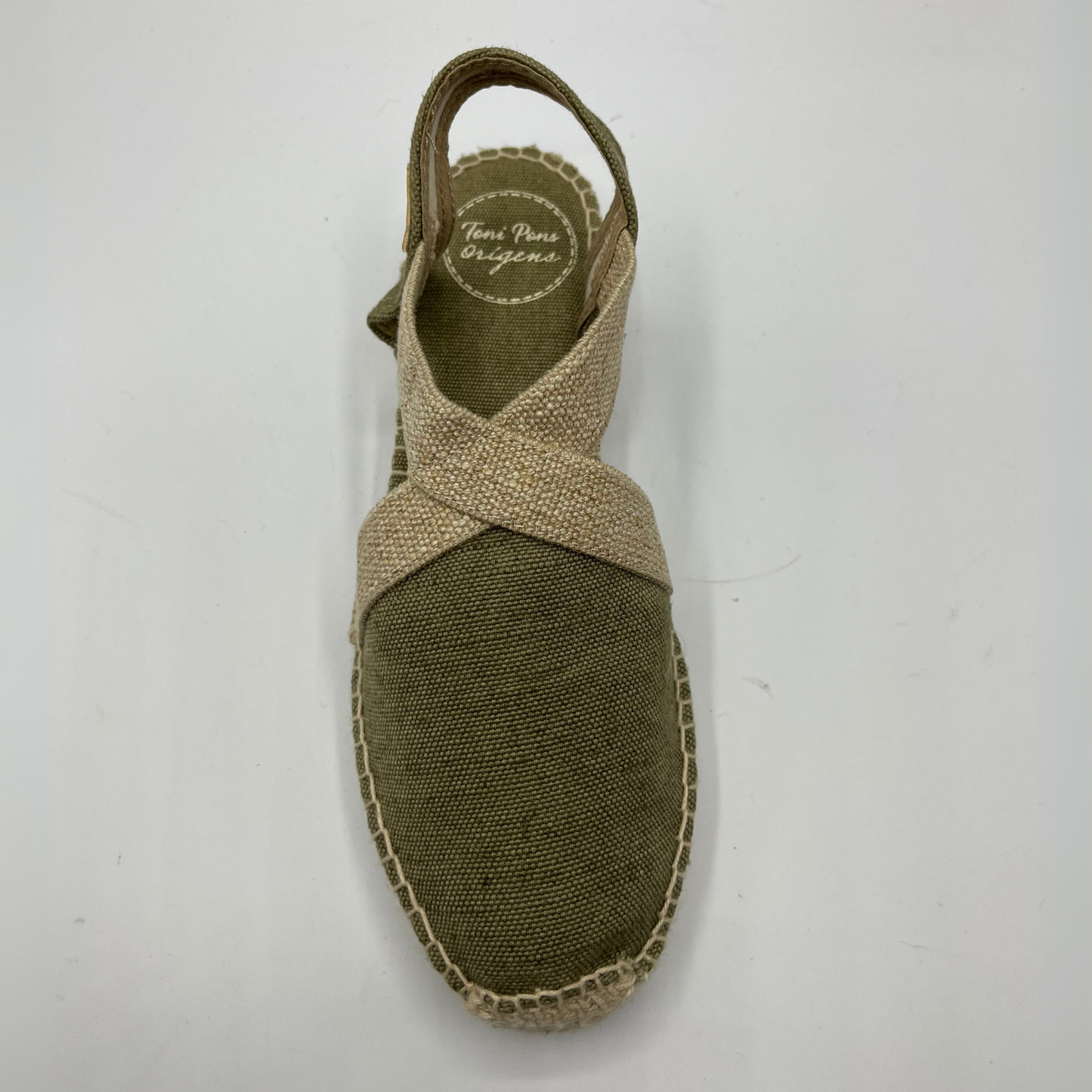 Top view of a canvas and textile espadrille with a low platform sole.