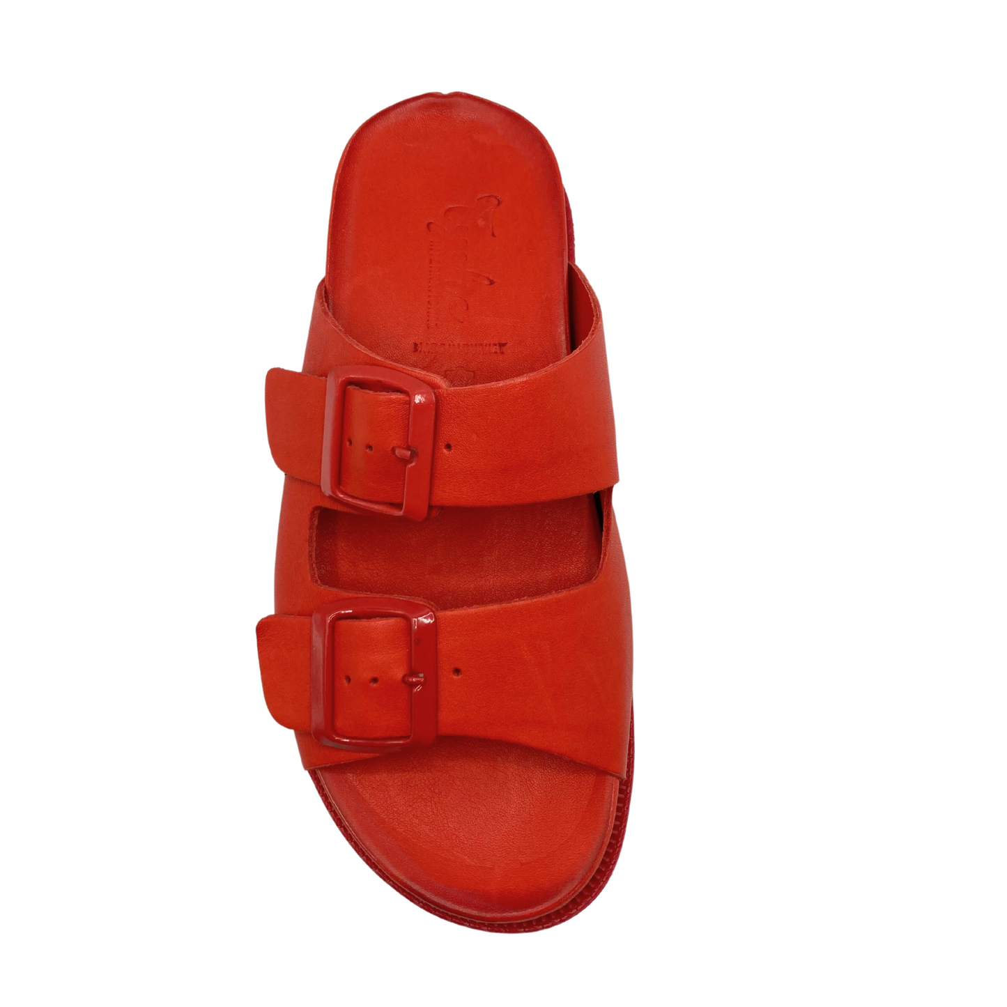 Top down view of a flat summer sandal in a deep red leather. Open toe and back with 2 cross straps. Both straps are adjustable