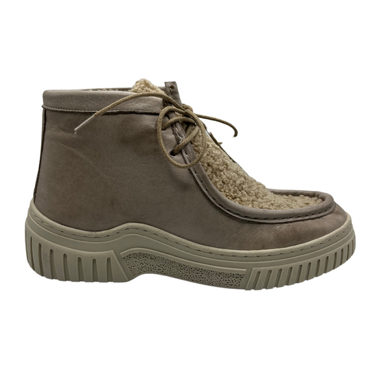 Right facing view of leather and sherpa ankle boot with thin laces and thick cream coloured outsole