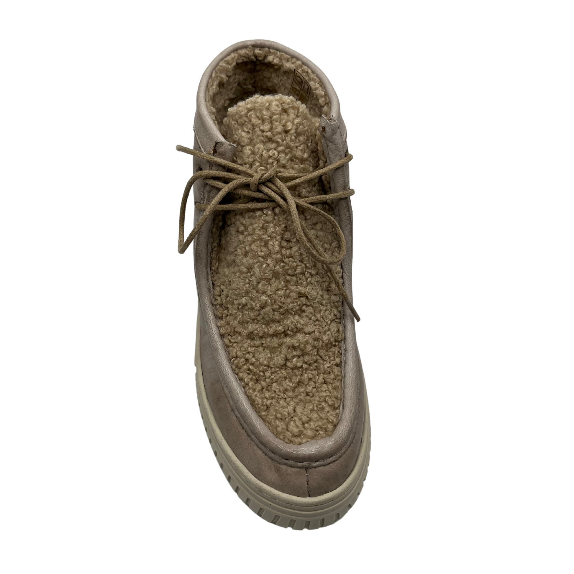 Top view of leather and sherpa ankle boot with thin laces and thick cream coloured outsole