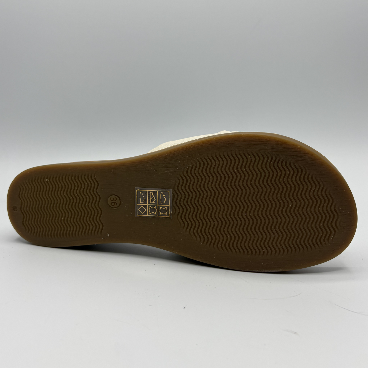 Brown sole of a shoe on a white background