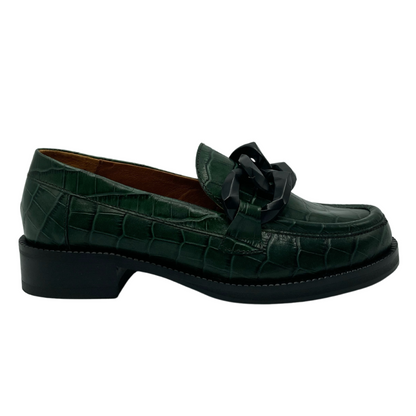 Right facing view of textured green leather loafer with black outsole and black chain detail on upper