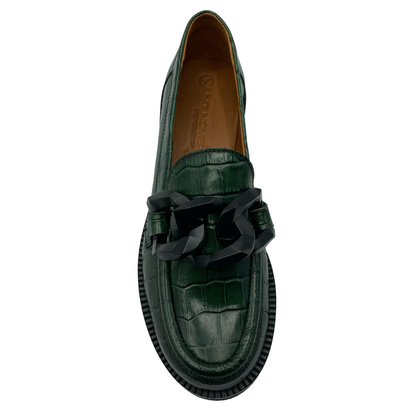 Top view of green textured leather loafer with rounded toe and chunky chain detail on upper