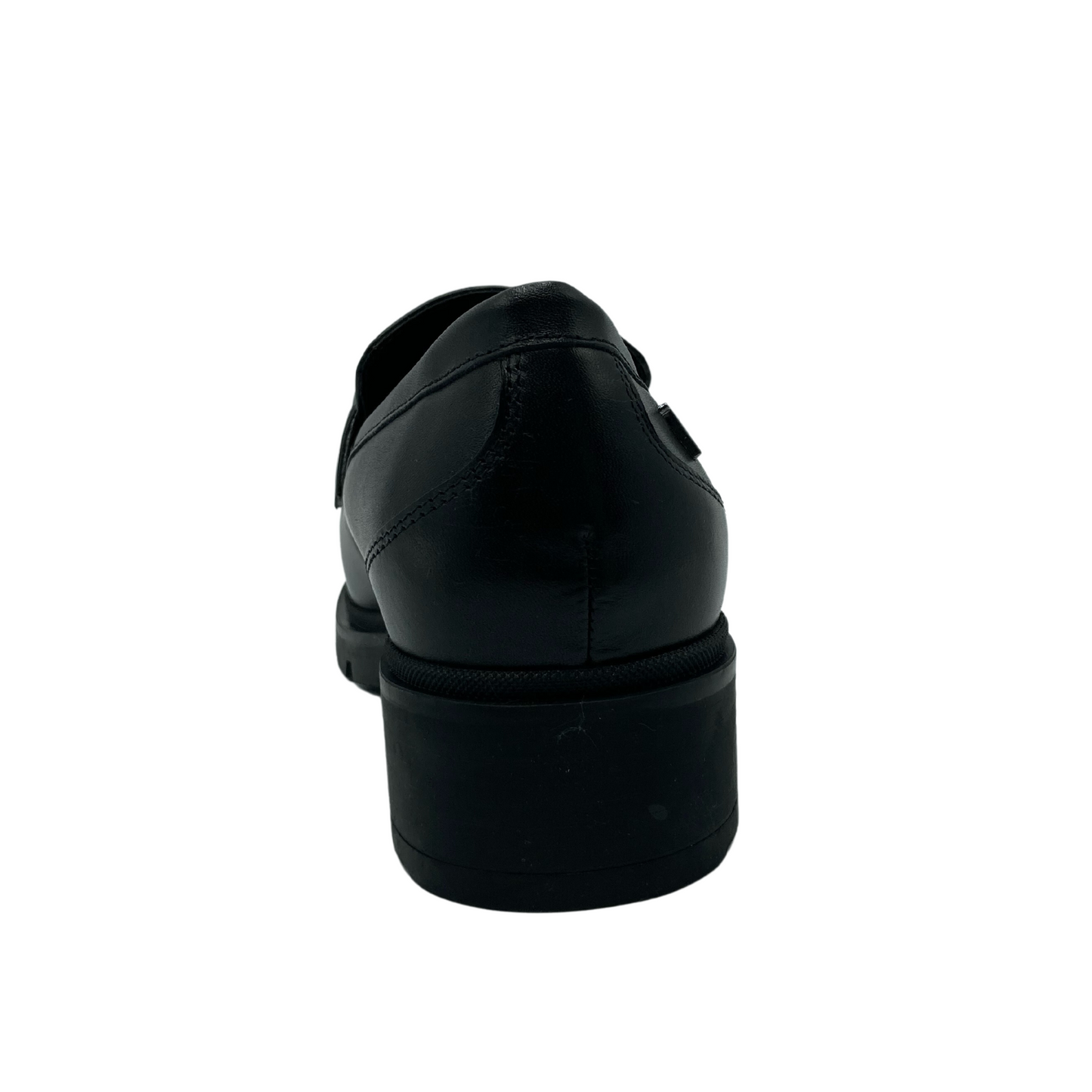 Back view of black leather loafer with black rubber outsole and block heel