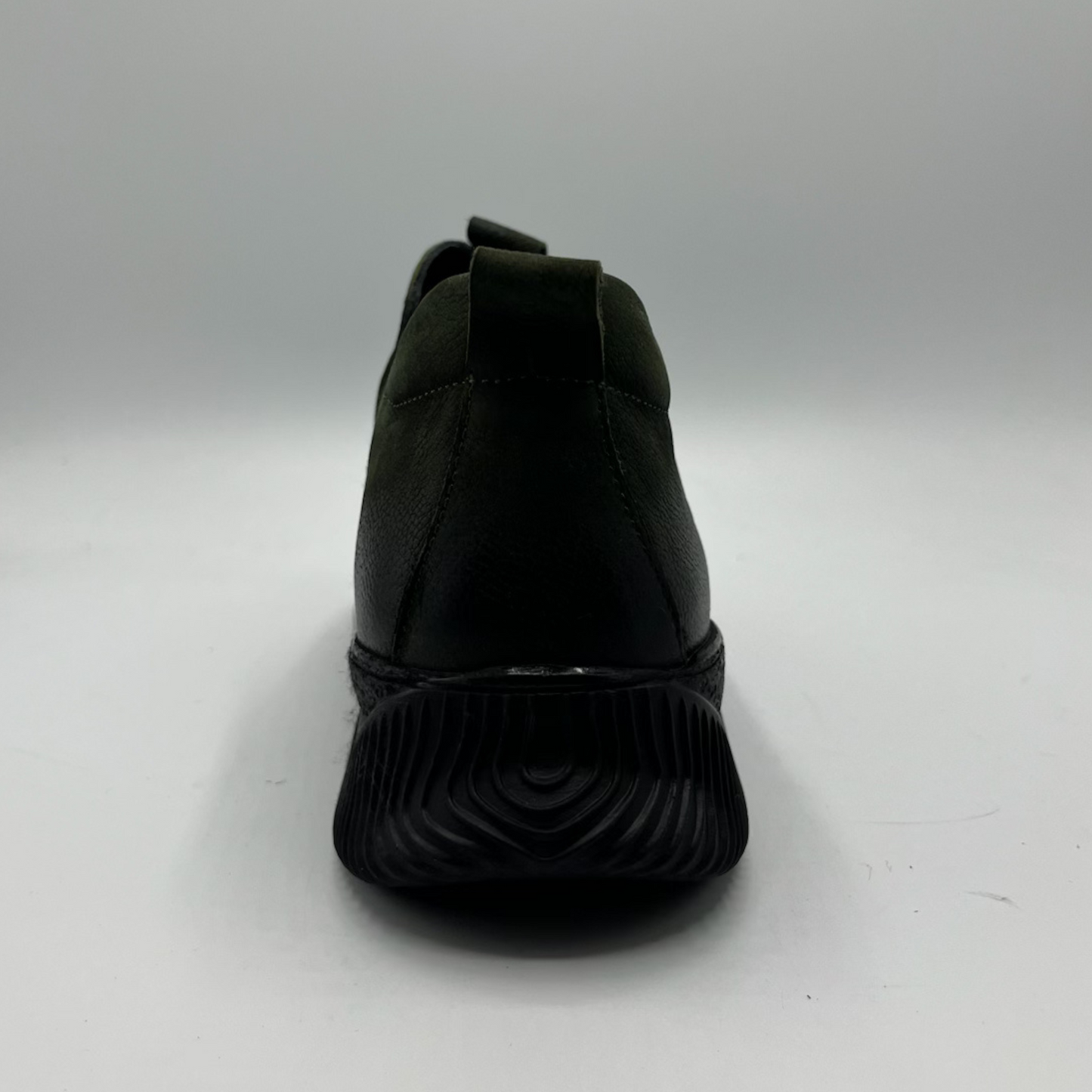 Dark green shoe on a white background
