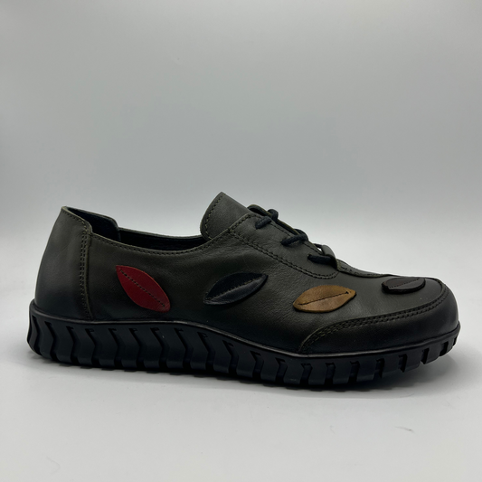 Olive shoe with unique design elements on a gray background