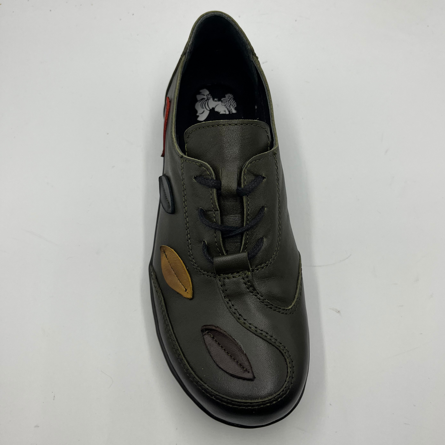 Olive shoe with a unique design on a white background